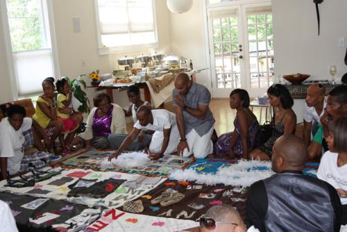The &ldquo;Atl Fam&rdquo; (or &ldquo;Team Kenny&rdquo;) as they refer to themselves, gather around the block they made for Kenny at the home of Terry Hooks and Richard Moultrie. Photo by Anna Kaplan, Smithsonian Institution