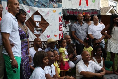The community of friends gathers in front of the block they made for Kenny Williams. Photo by Anna Kaplan, Smithsonian Institution