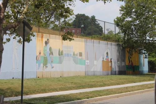 This older mural is located on Mississippi Avenue. The faded colors and rust stains show signs of aging, but they do not diminish the importance of education depicted.