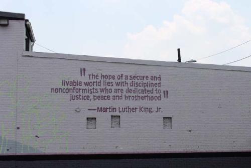 Farther down on the same wall is a quote from Martin Luther King, Jr., which articulates the themes of the mural.