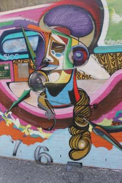 Decorating Benning Park Community Center, this was painted by a muralist of the Albus Cavus troupe. 