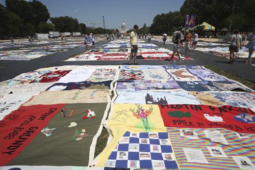 Visitors walk around blocks of The AIDS Memorial Quilt in the &ldquo;Creativity and Crisis&rdquo; program. Photo by Francisco Guerra, Smithsonian Institution