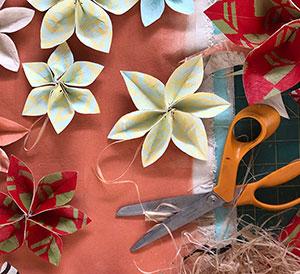 Paper flower crafts and scissors.