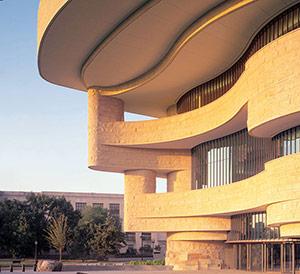 Curved exterior of the National Museum of the American Indian in DC.