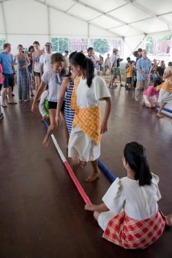 Members of the The Rehoboth Children’s Home Dance Team invite the audience to try tinikling dancing.
