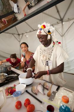 Issa Téssougué demonstrates Malian cooking in the Peace Corps program area.