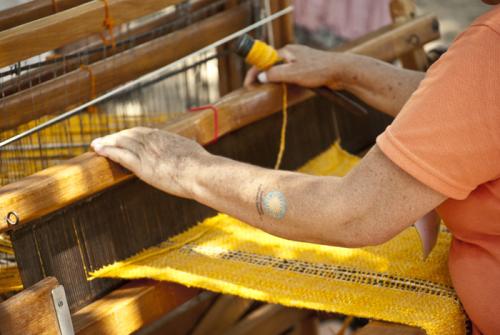 Ana Dolores Russi Suárez weaves at her loom in the Andean Highlands section of the Colombia program