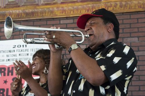 Dick Knight, trumpet player with the Monitors, plays from the Soulsville Stage.