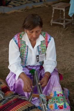 Danitza Lourdes Ramos de Gonzalez of Callalli, Peru, demonstrates weaving in the Peace Corps program.