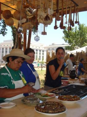 Sausage-making with Maria Florinda Coy Castilla, Maria Yolanda Franco Garcia, and Rufa Herrera de Perea at the Colombian foodways tent