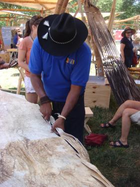 Hermes Romero Vidal cuts leather for hammocks made on Southeastern Plains
