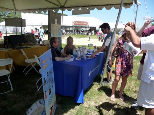 Visitor Information and Associates' Reception Center (VIARC) staff answer a visitor''s questions at the Ask the Smithsonian tent.