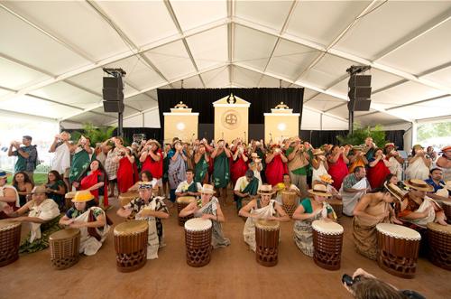 Dancers and musicians in hula group UNUKUPUKUPU perform in the Opening Ceremony of the 2012 Smithsonian Folklife Festival. Photo by Walter Larrimore, Ralph Rinzler Folklife Archives