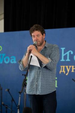 Welsh poet and singer Twm Morys at the <i>Voices of the World</i> stage, 2013 Folklife Festival. Photo by Maggie Pelta-Pauls, Ralph Rinzler Folklife Archives