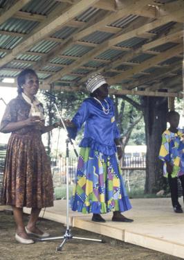 Olive Lewin moderates a session featuring a Kumina band from Jamaica, with Imogene "Queenie" Kennedy (right) at the 1989 Smithsonian Folklife Festival program The Caribbean: Cultural Encounters in the New World. Ralph Rinzler Folklife Archives a