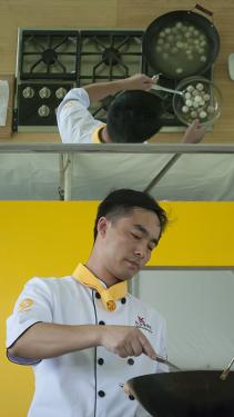 A foodways demonstration in China's Five Spice Kitchen.