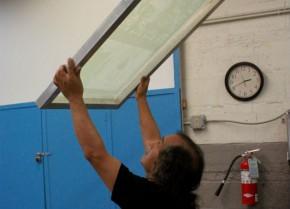 MONKY inspects a finished screen. Photo by Georgia Dassler, Ralph Rinzler Folklife Archives