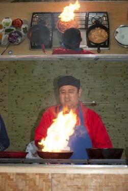 The weather may have been mild today, but El Fogón Kitchen was hot! Photo by JB Weilepp, Ralph Rinzler Folklife Archives