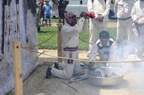 In one of the first events of the day, bridge builders from the Cusco region performed a ritual offering to Apu Q'eswachaka (a mountain spirit), asking permission and blessings in building the Q'eswachaka Bridge over the next two weeks. Photo by Joe Furga