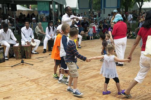 Miguel Ballumbrosio (center, standing) leads a dance as Tutuma performs at La Plaza. Photo by Brian Barger, Ralph Rinzler Folklife Archives