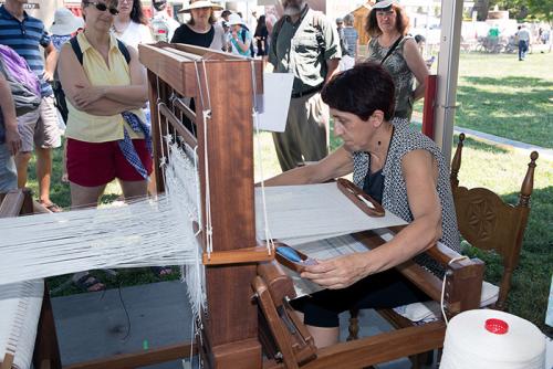 Olga Uribe Salaberria worked away on her loom, creating fine textiles. With her engineering background, she analyzed old cloths and restored an antique loom, leading a revival of this textile tradition. Photo by Francisco Guerra, Ralph Rinzler Folklife Ar