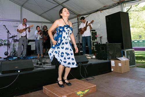 Martha Gonzalez is doing double-duty during the Folklife Festival, playing with the band Quetzal and with the FandangObon group. Today she danced on the tarima platform with her son jarocho group. You can find them each day at the Sounds of California Sta