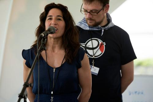 Irati Anda and Xabier Paya are bertsolariak, Basque poets who improvise songs on given topics. In today's "Berto Workshop," they sang about arriving in Washington, their favorite sports, and Xabi's amuma (grandmother). Photo by Maureen Spagnolo,