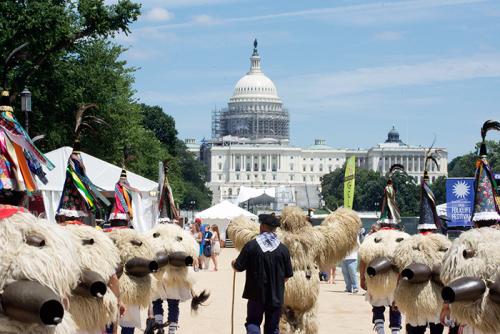 The Joaldunak practice a ritual procession in elaborate costumes: sheep skins, cone-shaped hats decorated with ribbons, and large—very loud—bells on their backs. Each afternoon through July 4, they will lead a parade around the National Mall. Photo by Ron