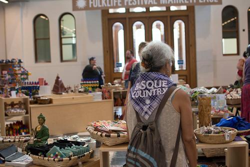 This is the first year the Festival Marketplace has been inside the Arts and Industries Building, which has been shuttered for twelve years. Inside you'll find crafts by Basque and Californian artists, plus merchandise from past Festivals. Photo by Olivia
