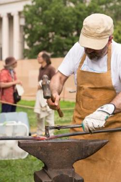 César Alcoz brought ironworking tools from Basque country and borrowed a forge from the Blacksmiths’ Guild of the Potomac. Photo by Pruitt Allen, Ralph Rinzler Folklife Archives